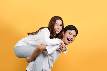 Cute Asian couple is proudly showing off their cheerful and happy expressions. He made the woman...