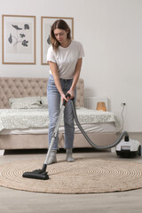 Housewife vacuuming the room, domestic life, apartment cleaning concept