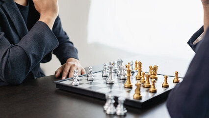 Businessman is playing chess game, leading strategy planning, business leader concept and thinking...