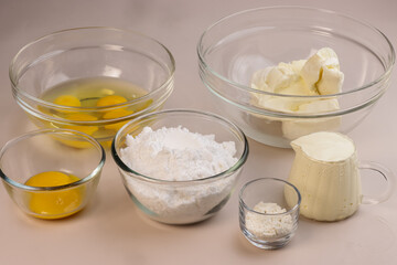 Bowl with Cream Cheese and Ingredients for Preparing Burnt Cheese Cake.