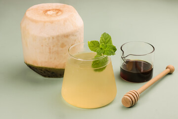 Glass of coconut juice with Honey is Herbal Drink for Detox.