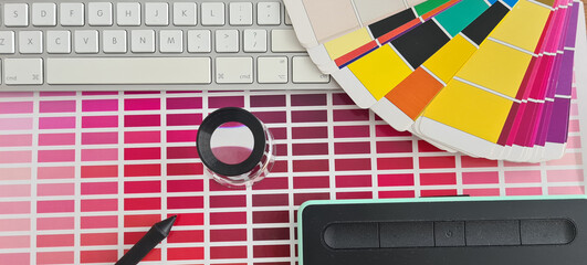 Graphic tablet stylus and color palette on table