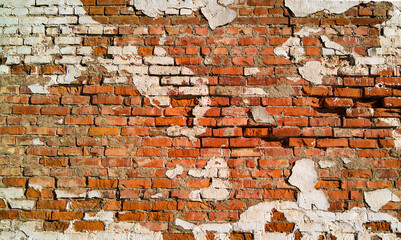 Old brick wall with white plaster