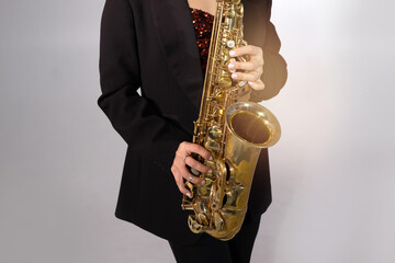 Obraz premium beautiful stylish saxophone in the hands of a musician