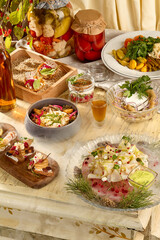 Assortment of Slavic appetizers: stroganina, pickled mushrooms, and various pickles in a rustic setting