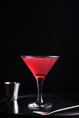 Cosmopolitan cocktail on a dark background.