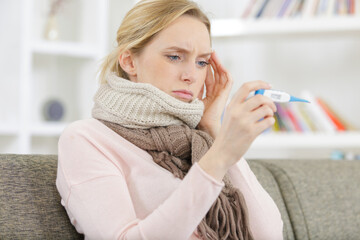 woman with a thermometer in her hand