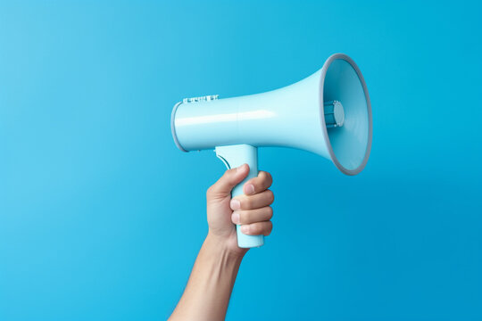 Human hand hold megaphone on plain color background with copy space. Generative AI