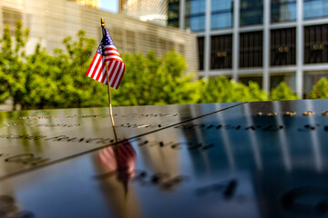 American flag at the World Trade Center memorial, tribute to the victims of the terrorist attack of...