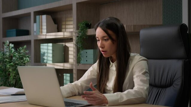Caucasian businesswoman in office computer error crash business woman girl female worker sit at desk work on laptop upset problem device system bug data loss battery low issue unsaved lost information
