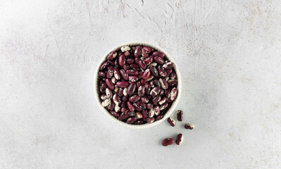Uncooked organic red bean in a bowl. Healthy eating concept. Top view.