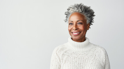 Smiling and elegant african american middle-aged woman wearing a cozy sweater conveying happiness. Copy Space.