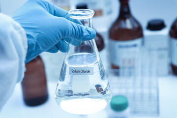Sodium chloride in chemical container , chemical in the laboratory and industry