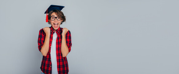 Finally I am a master! Advertising banner with excited and happy graduate girl in glasses and...