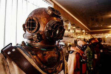 Old vintage copper diving suit - obrazy, fototapety, plakaty