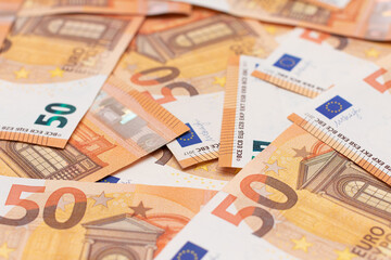 50 Euro Banknotes Money Background. Euro Money Currency. Orange Paper Money. A Lot of Fifty Euro...
