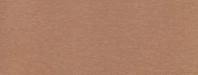 Texture of craft dark brown paper background colors, macro. Structure of vintage kraft umber cardboard.