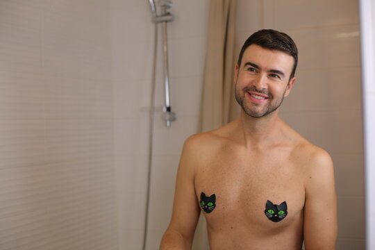 Man using cute nipple covers with cat shape
