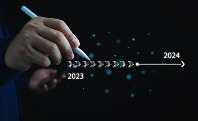 2024,Businessman touch on virtual bar status to change from 2023 to 2024, countdown of merry...