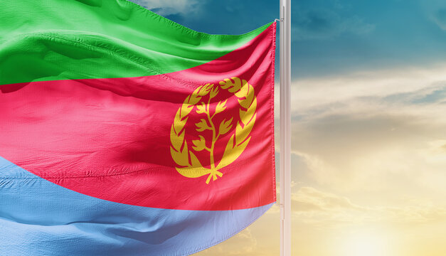Waving flag of Eritrea in beautiful sky. Flag for independence day - Image
