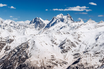 Snowy mountains. Beautiful landscape with snowy rocks. View from the top of Mount Elbrus