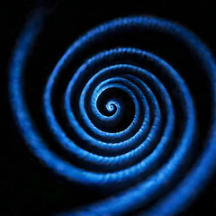 Glowing blue spiral on a black background
