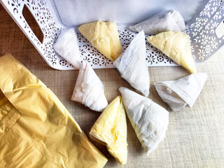 Plastic bag folded into a triangle for storage. Ways of storing and laying at home