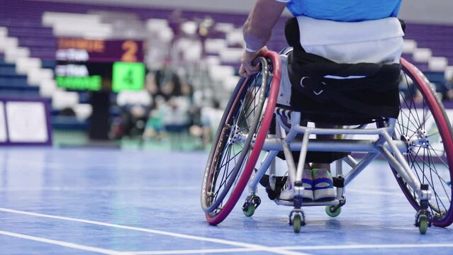 Take a video from behind Enjoy life Asian male sits in a competitive wheelchair preparation before a match training badminton