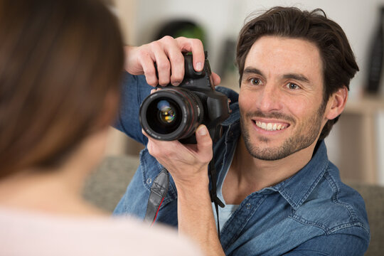 close view of man photographing woman