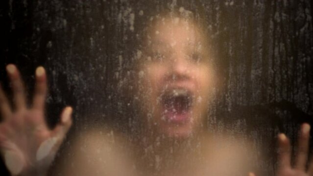 Asian pysco stress scream woman while shower hand and face blur over glass window mental problem concept