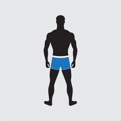 Standing guy of normal weight in swimming trunks