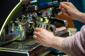 Fototapeta na wymiar Barista coffee service concept.Barista women using coffee machine to make coffee in cafe