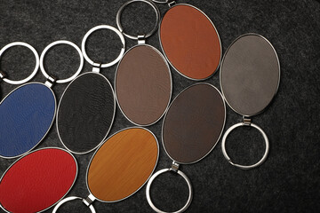 Metal and leather keychains. Colorful one side leather; Square, rectangle and circle shaped key rings. Concept shots, photos taken specially for e-commerce sales.
