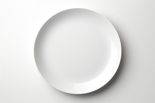 A white plate on a white surface.