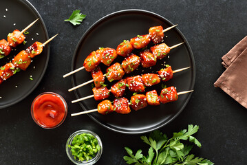 Teriyaki chicken skewers on plate