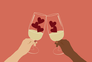 Close up of multiracial's hands holding glasses of champagne cheers to valentine's day celebration with red hearts line up in the glasses.
