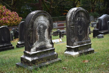 Fototapeta premium Two Old Tombstones at Sleepy Hollow Cemetery, Historic New York