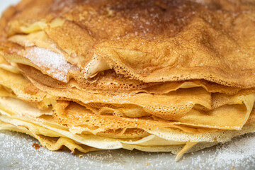detail of a pile of Galician style crepes, filloas