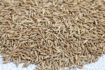 Cumin Jeera spice background. close-up view of zira. Cumin seeds from above. High angle photo of...