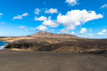 Panoramic view of the rocky coastline of Papagago on Lanzarote in a volcanic landscape in Los Ajaches National Park. Playa Blanca, Lanzarote, Spain
