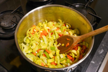 Fresh healthy vegetables  cooking in a metal pan