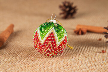 Exquisite handmade Christmas bubble toy from beads, also known as a Christmas globe or Christmas bulb, is a part of holiday decor.