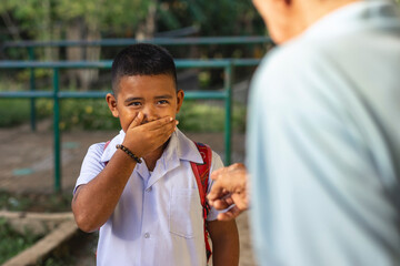 A young elementary student feels embarrassed after being scolded by an old man for loitering...