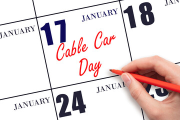 January 17. Hand writing text Cable Car Day on calendar date. Save the date.