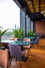 Cafe with large windows with a view of the city