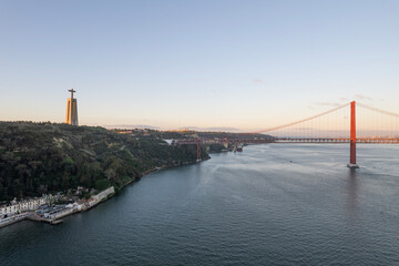 aerial drone travel view of Sanctuary of Christ the King-Portugal and bridge in lisbon portugal