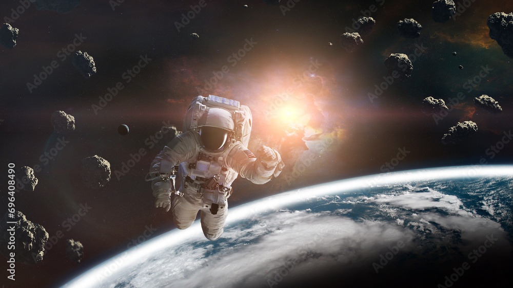 Wall mural cosmonaut with asteroids in low-earth orbit. elements of this image furnished by nasa.