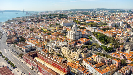 Cinematic aerial perspective of beautiful Lisbon capital city of Portugal. View of National Pantheon. Famous European travel destination. Rooftops of Lisbon. Panoramic view of all city center