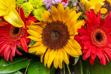 Bright flower bouquet with sunflowers. Nature background.