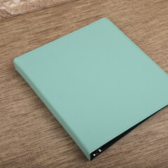 Personalized binding, leather folder cover, leather binding, binder, binder, office binding, corporate gift. Concept shot leather binding, top view, colorful